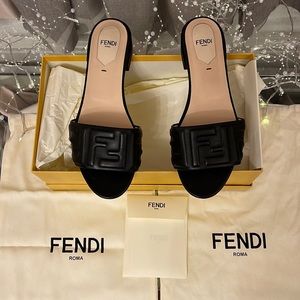 Fendi Rich Leather Mules Embossed With Fendi's Sig